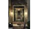 Close-up of an ornate front door with decorative sidelights and lighting fixtures at 275 Old Mill Ct, Fayetteville, GA 30214