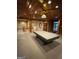 Large game room features a pool table, unique lighting, built in shelves and custom wood detailing at 275 Old Mill Ct, Fayetteville, GA 30214