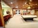Well-appointed game room featuring a bar area, billiard table, and ample space for entertaining at 275 Old Mill Ct, Fayetteville, GA 30214