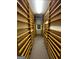 Long hallway lined with floor to ceiling bookshelves and custom woodworking at 275 Old Mill Ct, Fayetteville, GA 30214
