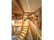 View of a long hallway that passes the game room featuring wood accents and carpeted floors at 275 Old Mill Ct, Fayetteville, GA 30214