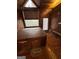 An indoor hot tub area with wood-paneled walls, a window, and an exterior door at 275 Old Mill Ct, Fayetteville, GA 30214