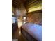 A hot tub room featuring vaulted ceilings, wood paneling, and access to a nearby bathroom at 275 Old Mill Ct, Fayetteville, GA 30214