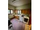 Functional laundry room with cabinets, sink, and modern washer and dryer at 275 Old Mill Ct, Fayetteville, GA 30214