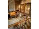 Spacious multi-level living room features a brick fireplace, built-in cabinetry, and lots of natural light at 275 Old Mill Ct, Fayetteville, GA 30214