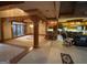 Open-concept layout with chandeliers, bar seating, and a glimpse of the kitchen at 275 Old Mill Ct, Fayetteville, GA 30214