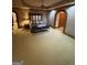 Spacious main bedroom with neutral carpet, decorative ceiling trim, and generous closet space at 275 Old Mill Ct, Fayetteville, GA 30214