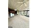 Spacious screened-in porch featuring ceiling fans, carpet and multiple windows allowing natural light to enter at 275 Old Mill Ct, Fayetteville, GA 30214