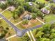 Aerial view of neighborhood homes with mature trees and landscaping offering picturesque curb appeal at 830 Streamside Dr, Mcdonough, GA 30252