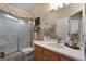 Well-lit bathroom features a shower, toilet, vanity, and a neutral color scheme at 830 Streamside Dr, Mcdonough, GA 30252