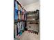 Organized walk-in closet with clothing racks, shelves, and ample storage space at 830 Streamside Dr, Mcdonough, GA 30252