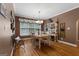 Dining room with large windows and hardwood floors that bring natural light and warmth at 830 Streamside Dr, Mcdonough, GA 30252