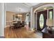 Elegant dining room featuring hardwood floors, chandelier, and views of the front entrance at 830 Streamside Dr, Mcdonough, GA 30252