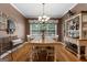 Dining room with a chandelier and large windows and hardwood floors that bring natural light and warmth at 830 Streamside Dr, Mcdonough, GA 30252