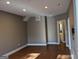 Spacious living room featuring hardwood floors and neutral paint, ready for personalization and your special touches at 1272 Creekside Se Ter, Smyrna, GA 30082