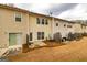 Townhome featuring a quaint backyard patio with space for outdoor seating, a door, and fenced yards at 2786 Snapfinger Mnr, Decatur, GA 30035
