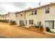 Townhome featuring a quaint backyard patio with space for outdoor seating, a door, and a fenced yard at 2786 Snapfinger Mnr, Decatur, GA 30035
