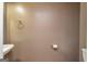 Neutral-toned half-bathroom featuring a modern sink, toilet paper holder, and towel ring at 2786 Snapfinger Mnr, Decatur, GA 30035