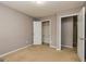 Calm bedroom showcasing a closet, neutral walls, plush carpeting, and a cozy atmosphere for a relaxing sleep at 2786 Snapfinger Mnr, Decatur, GA 30035