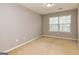 Cozy bedroom featuring neutral walls, carpeted floors, natural light, and ample space for relaxation at 2786 Snapfinger Mnr, Decatur, GA 30035