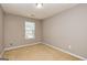 Inviting bedroom featuring a bright window, carpeted floor, neutral walls, and a relaxing ambiance at 2786 Snapfinger Mnr, Decatur, GA 30035