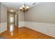 Charming dining room boasts hardwood floors and a stylish chandelier at 2786 Snapfinger Mnr, Decatur, GA 30035