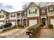 Exterior shot of townhomes with tidy landscaping, mailboxes, and convenient driveway parking at 2786 Snapfinger Mnr, Decatur, GA 30035