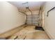 Spacious two-car garage featuring painted walls, concrete floor, and an automatic door opener at 2786 Snapfinger Mnr, Decatur, GA 30035