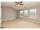 Spacious main bedroom featuring a ceiling fan and multiple windows at 2786 Snapfinger Mnr, Decatur, GA 30035