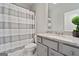 Neutral bathroom featuring a shower/tub combination, granite countertop, and gray cabinetry at 5915 Langdale Chase # 16, Douglasville, GA 30135