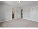 Spacious bedroom features multiple doorways, carpeted floor, and neutral paint at 5915 Langdale Chase # 16, Douglasville, GA 30135