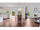 Open floor plan with modern kitchen leading into a dining area with lots of natural light at 5915 Langdale Chase # 16, Douglasville, GA 30135