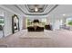 This spacious main bedroom features a tray ceiling, sitting area, and plush carpet, creating a luxurious retreat at 5915 Langdale Chase # 16, Douglasville, GA 30135