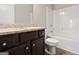 Well-lit bathroom featuring a vanity with granite countertop and a shower-tub combination at 6600 Wansfell Ct # 28, Douglasville, GA 30135