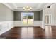 Dining room featuring rich hardwood floors, custom trim, and a modern chandelier at 6600 Wansfell Ct # 28, Douglasville, GA 30135