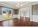Dining room with hardwood floors, decorative columns and trim and a chandelier at 6600 Wansfell Ct # 28, Douglasville, GA 30135
