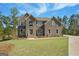 Stunning exterior elevation with a well-manicured lawn, complemented by lush trees and beautiful sky at 6600 Wansfell Ct # 28, Douglasville, GA 30135