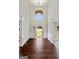 Grand foyer featuring soaring ceilings, elegant millwork, and gleaming hardwood floors at 6600 Wansfell Ct # 28, Douglasville, GA 30135