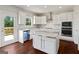 Well-appointed kitchen featuring white cabinets, stainless steel appliances, and granite countertops at 6600 Wansfell Ct # 28, Douglasville, GA 30135