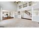 Bright living room featuring hardwood floors, plush carpeting, and large windows allowing for natural light at 6600 Wansfell Ct # 28, Douglasville, GA 30135
