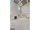 Spacious living room with plush carpeting, fireplace, soaring ceilings, and great natural light at 6600 Wansfell Ct # 28, Douglasville, GA 30135