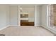 Elegant living room featuring neutral carpet, white trim and ample natural light from the window at 6600 Wansfell Ct # 28, Douglasville, GA 30135