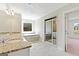 The main bath offers double sinks, a soaking tub, a shower, and tile flooring at 6600 Wansfell Ct # 28, Douglasville, GA 30135