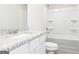 Bathroom featuring a vanity with granite countertops and a tub with shower at 287 Limestone Circle, Conyers, GA 30013