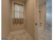 Bathroom with natural light, stylish vanity, and a clear view to the subway tile shower at 5118 N Pratt St, Covington, GA 30014