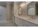 Bathroom with double vanity, quartz countertops, custom tile floors, and walk-in shower at 5118 N Pratt St, Covington, GA 30014