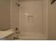 Bright bathroom showcasing a subway tiled shower with built-in niche and modern fixtures at 5118 N Pratt St, Covington, GA 30014