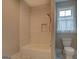 Bright bathroom featuring subway tiled shower, a built-in niche and modern fixtures at 5118 N Pratt St, Covington, GA 30014
