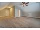 Large bedroom featuring plush carpet, neutral walls, and access to extra storage at 5118 N Pratt St, Covington, GA 30014