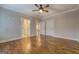 Spacious bedroom features hardwood floors, crown molding, and en-suite bathroom at 5118 N Pratt St, Covington, GA 30014